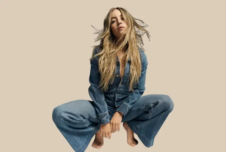 Sydney Sweeney in blue denim outfit posing
